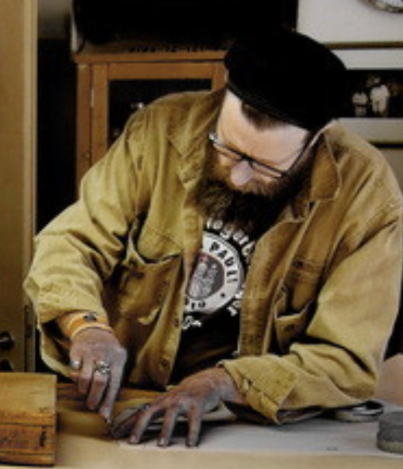 Moose in the workshop working on custom motorcycle parts